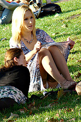 Blonde in park hiding upskirt